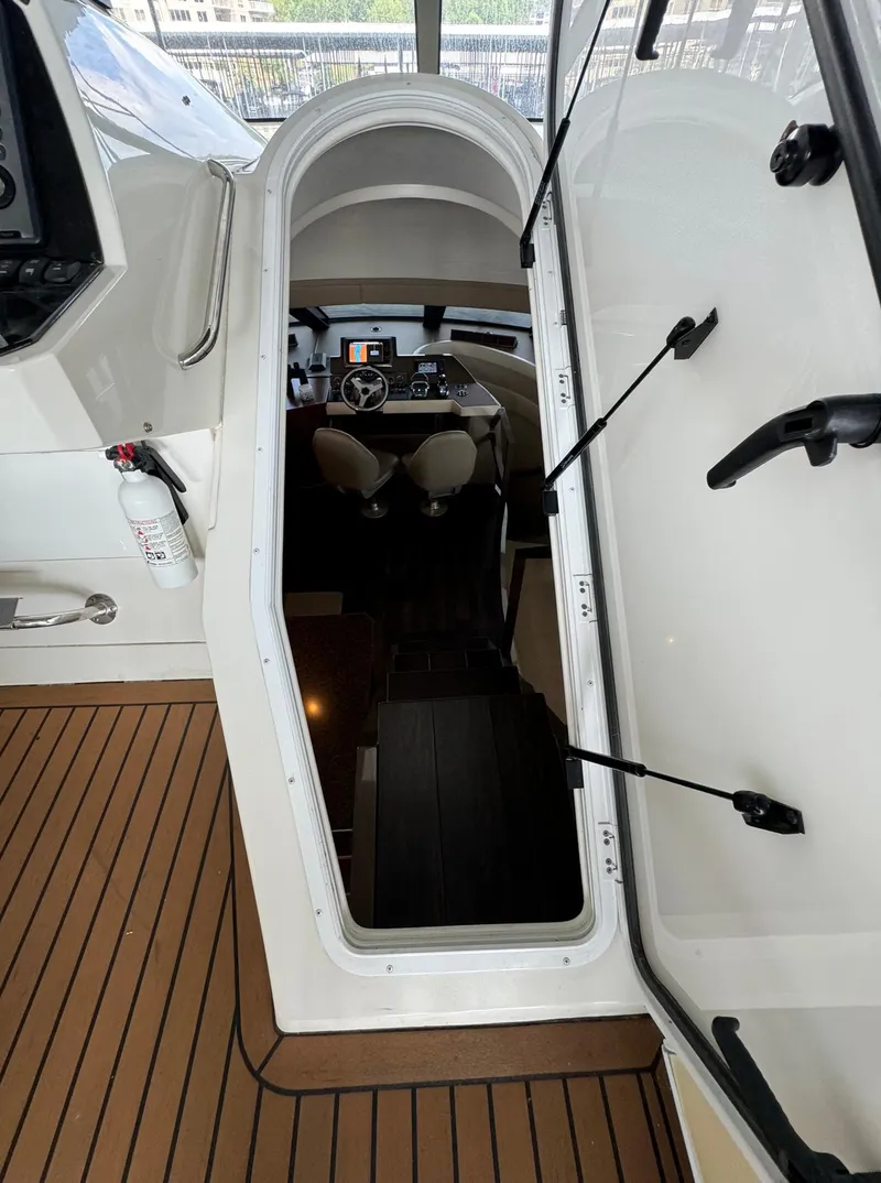 Slide: The Image of Stairway leading to the helm of a 2013 Carver 54 Voyager yacht. - 44
