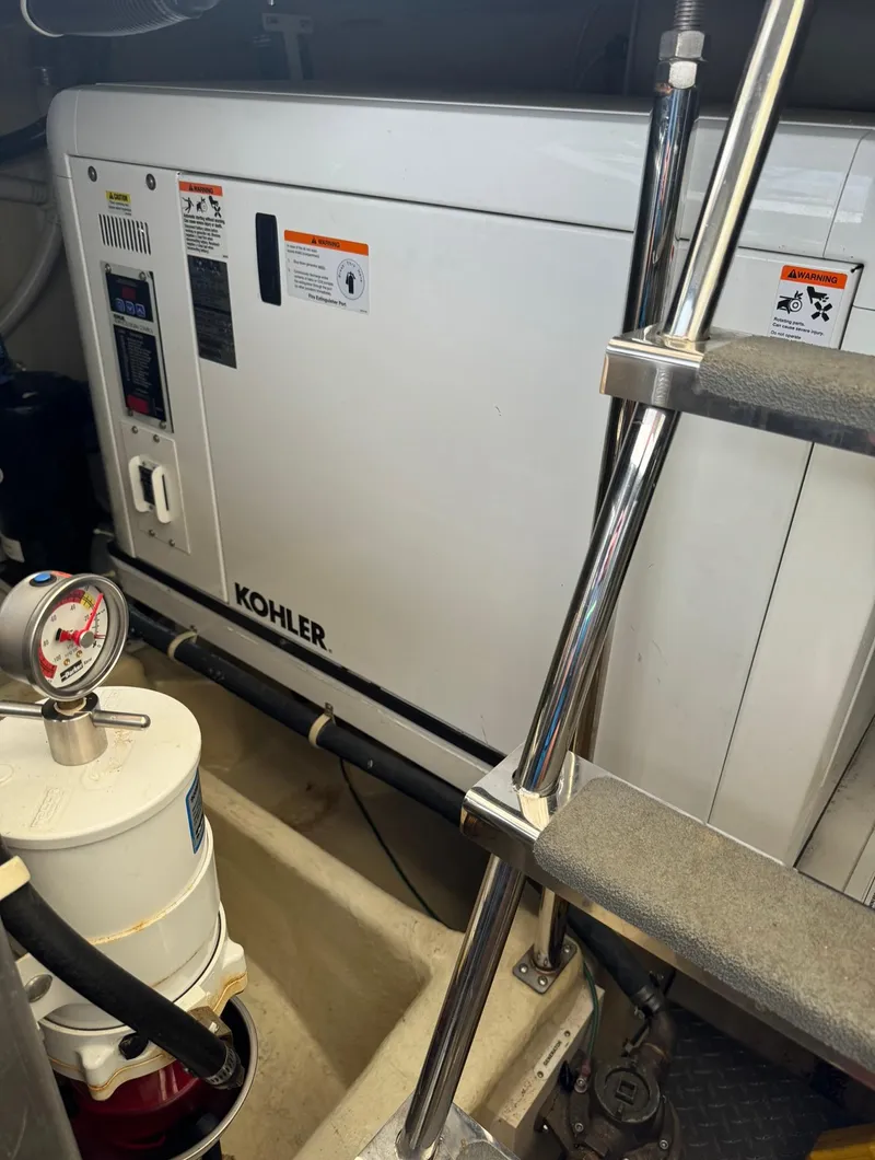 Slide: The Image of Engine room of 2013 Carver 54 Voyager with Kohler generator. - 46