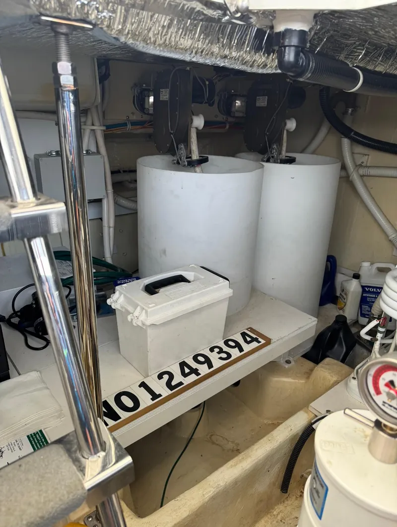 Slide: The Image of Engine room of 2013 Carver 54 Voyager yacht with equipment and storage. - 47