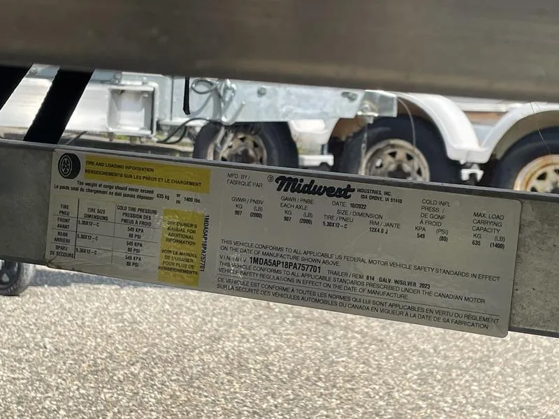 Slide: The Image of Label on a 2023 Lund 1600 Fury boat trailer, showing specifications and compliance details. - 11