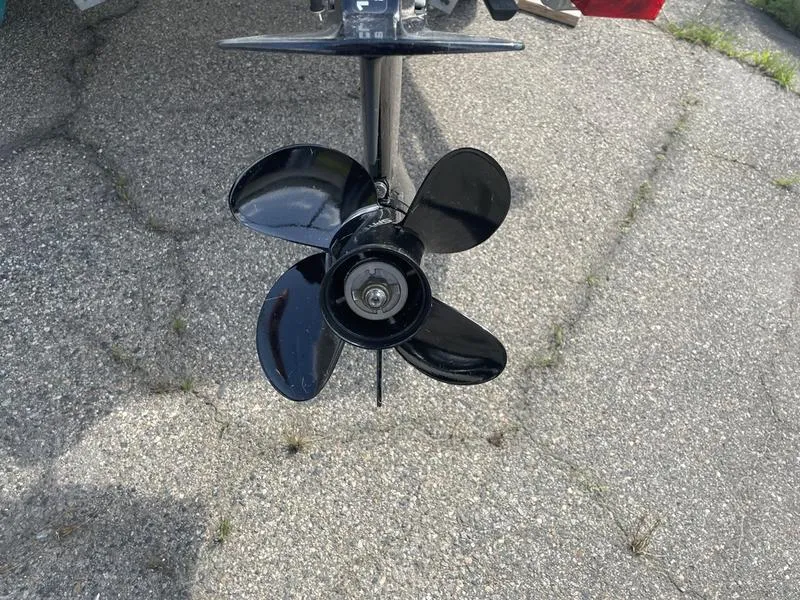 Slide: The Image of 2023 Lund 1600 Fury boat propeller on pavement background. - 14