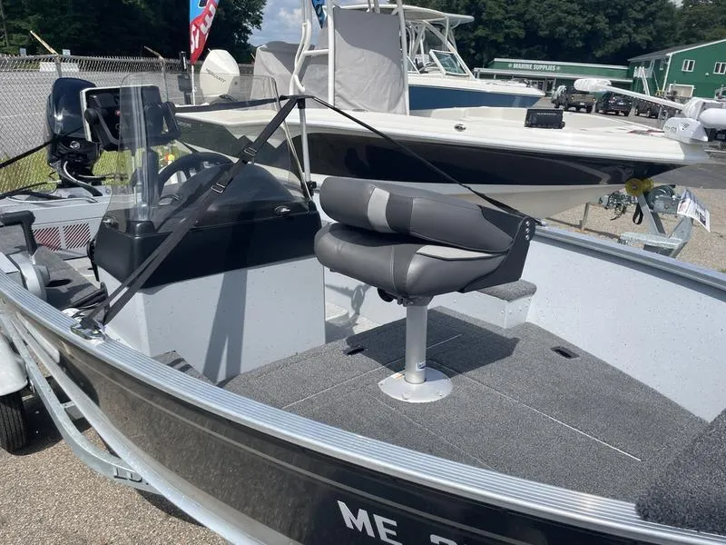 Slide: The Image of 2023 Lund 1600 Fury boat interior with seating and steering console. - 5
