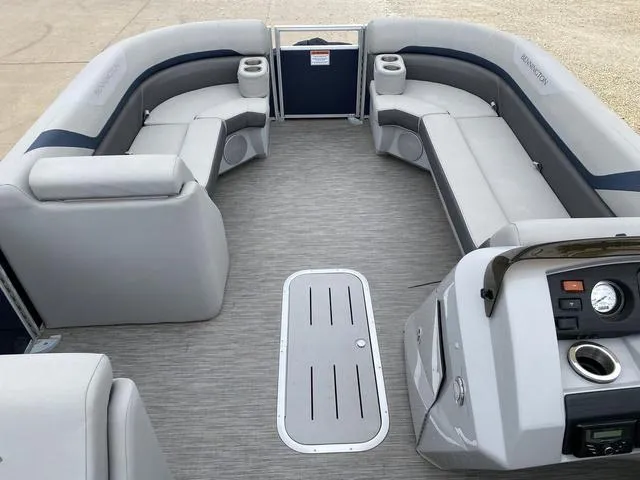 Slide: The Image of 2022 Bennington 22 SSBX pontoon boat interior with gray seating and control panel. - 16