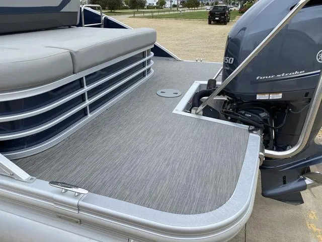 Slide: The Image of 2022 Bennington 22 SSBX pontoon boat with Yamaha outboard motor, rear deck view. - 6