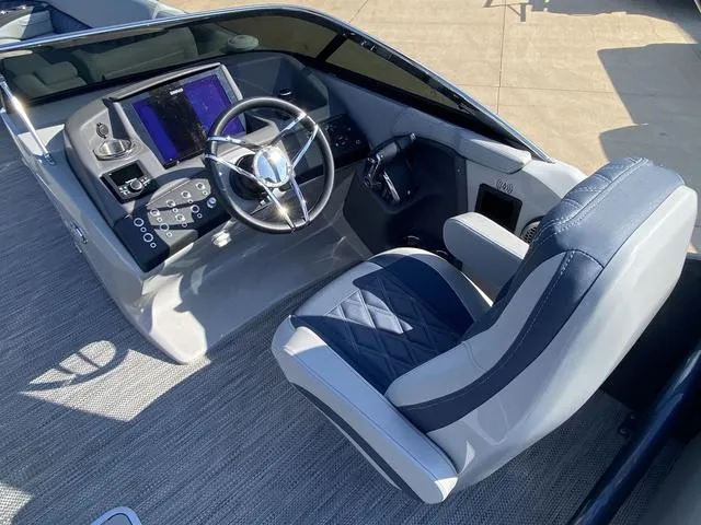 Slide: The Image of 2023 Bennington 30 QXSBWA X2 boat cockpit with modern steering and controls. - 10