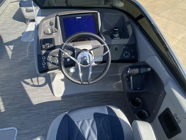 Slide: The Image of 2023 Bennington 30 QXSBWA X2 boat dashboard with steering wheel and control panel. - 11