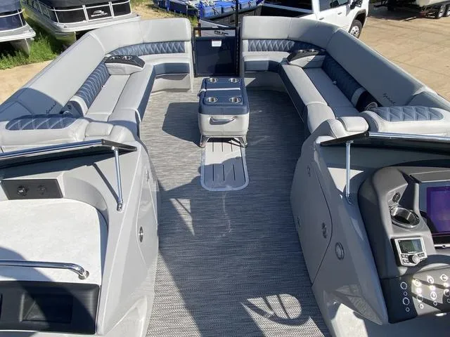 Slide: The Image of 2023 Bennington 30 QXSBWA X2 pontoon boat with spacious seating and modern dashboard. - 15