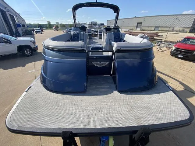 Slide: The Image of 2023 Bennington 30 QXSBWA X2 pontoon boat, blue exterior, docked at marina. - 3