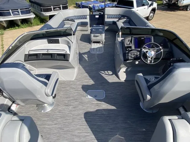 Slide: The Image of 2023 Bennington 30 QXSBWA X2 boat interior with modern seating and controls. - 7