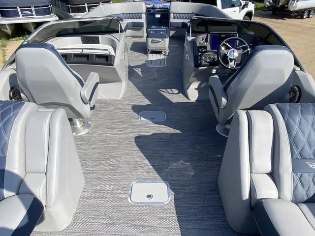 Slide: The Image of 2023 Bennington 30 QXSBWA X2 boat interior with luxurious seating and modern dashboard. - 8