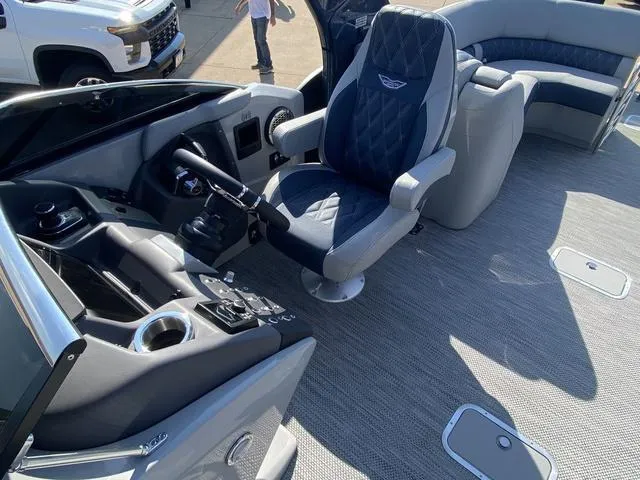 Slide: The Image of 2023 Bennington 30 QXSBWA X2 boat interior with captain's chair and control panel. - 9