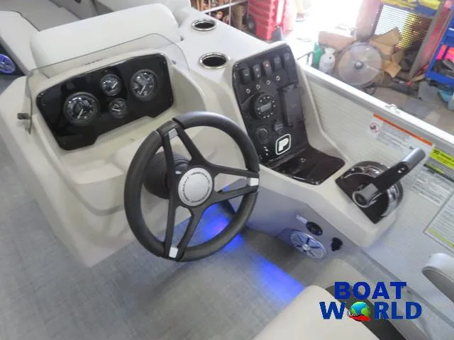 Slide: The Image of 2025 Princecraft Vectra 21 Cruise Lounge Pontoon dashboard with steering wheel and controls. - 11