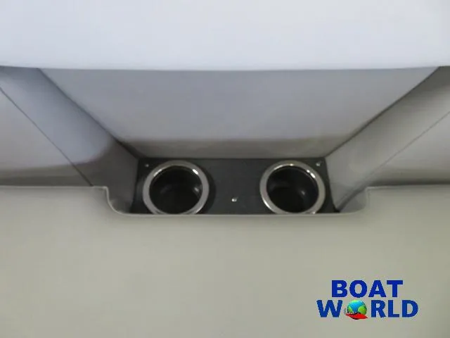 Slide: The Image of 2025 Princecraft Vectra 21 Cruise Lounge Pontoon cup holders, interior detail, Boat World logo. - 20