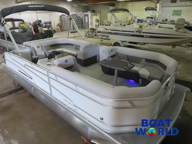 Slide: The Image of 2025 Princecraft Vectra 21 Cruise Lounge Pontoon in showroom, featuring Mercury 4-Stroke engine. - 36