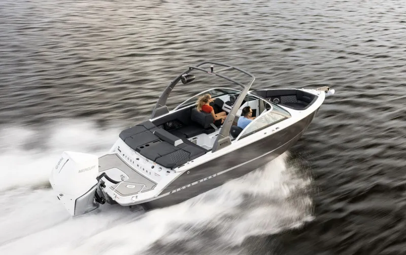 Slide: The Image of 2018 Four Winns HD240 OB boat cruising on open water. - 11