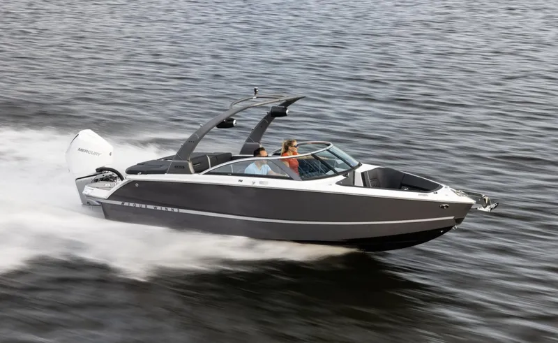 Slide: The Image of 2018 Four Winns HD240 OB speedboat cruising on open water. - 12