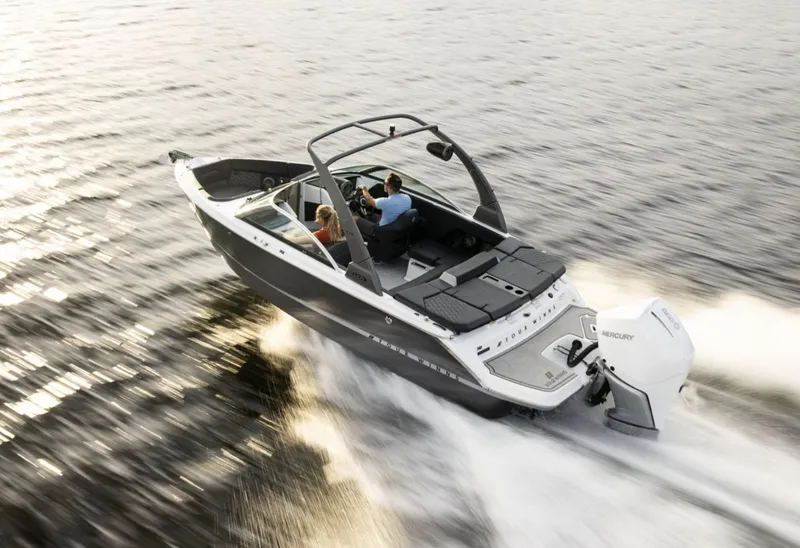 Slide: The Image of 2018 Four Winns HD240 OB boat cruising on water, featuring sleek design and powerful outboard engine. - 13