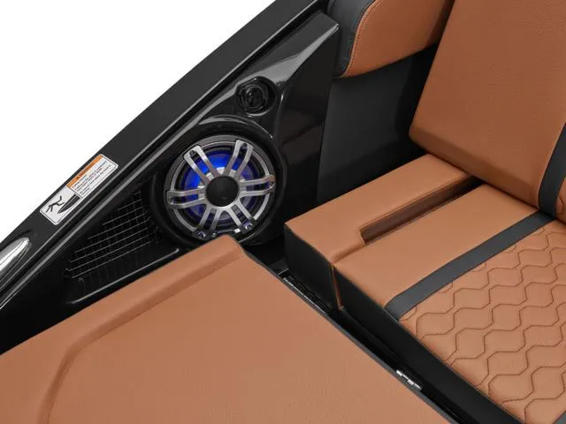 Slide: The Image of 2025 Yamaha Boats 255XD interior with brown leather seats and built-in speaker. - 12