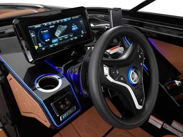 Slide: The Image of 2025 Yamaha Boats 255XD dashboard with touchscreen and illuminated steering wheel. - 14