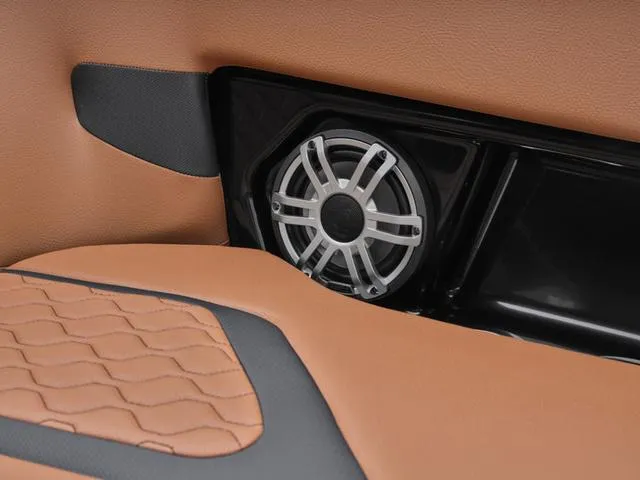 Slide: The Image of Yamaha Boats 255XD 2025 interior speaker with tan and black upholstery. - 18