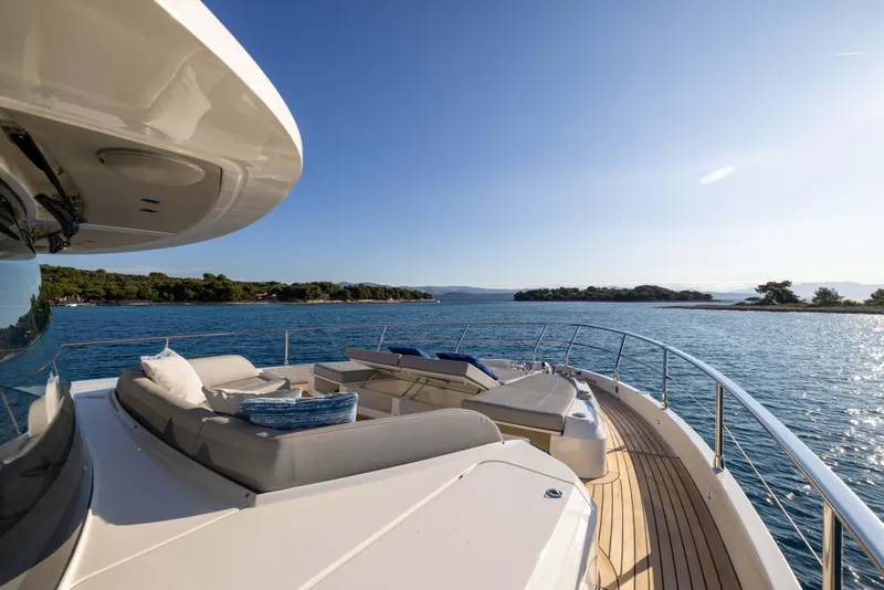 Slide: The Image of Luxurious 2024 Absolute NAVETTA 75 yacht deck with scenic ocean view. - 26