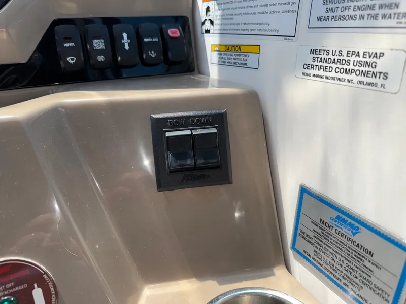 Slide: The Image of Control panel of a 2017 Regal 28 Express boat with certification labels. - 34