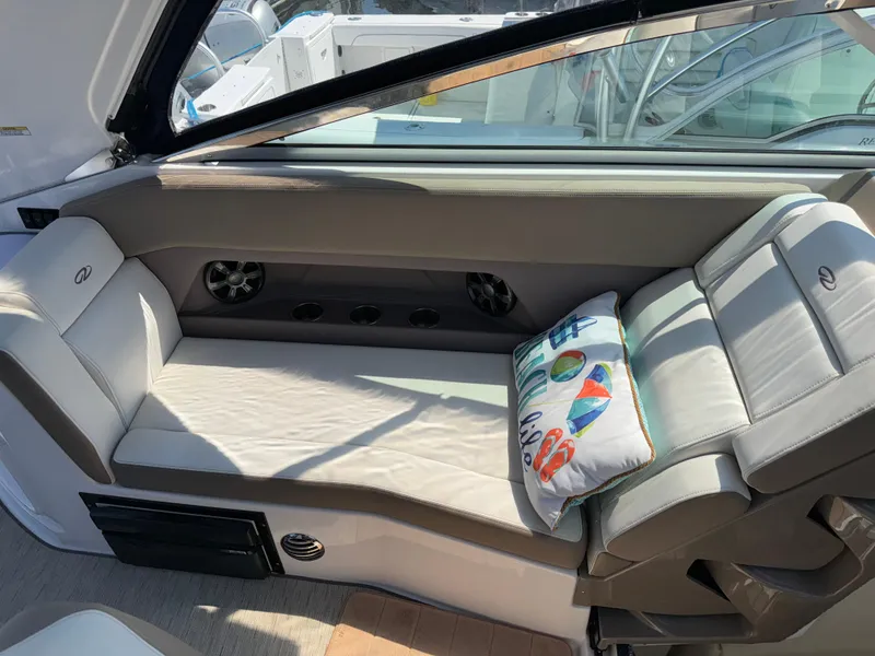Slide: The Image of Interior seating of 2017 Regal 28 Express boat with decorative pillow. - 25