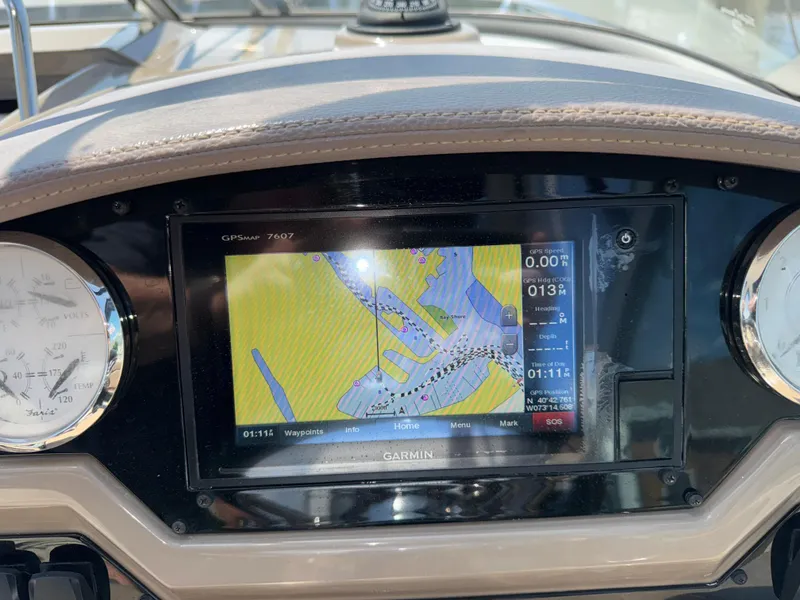 Slide: The Image of Garmin GPS display on 2017 Regal 28 Express boat dashboard. - 31