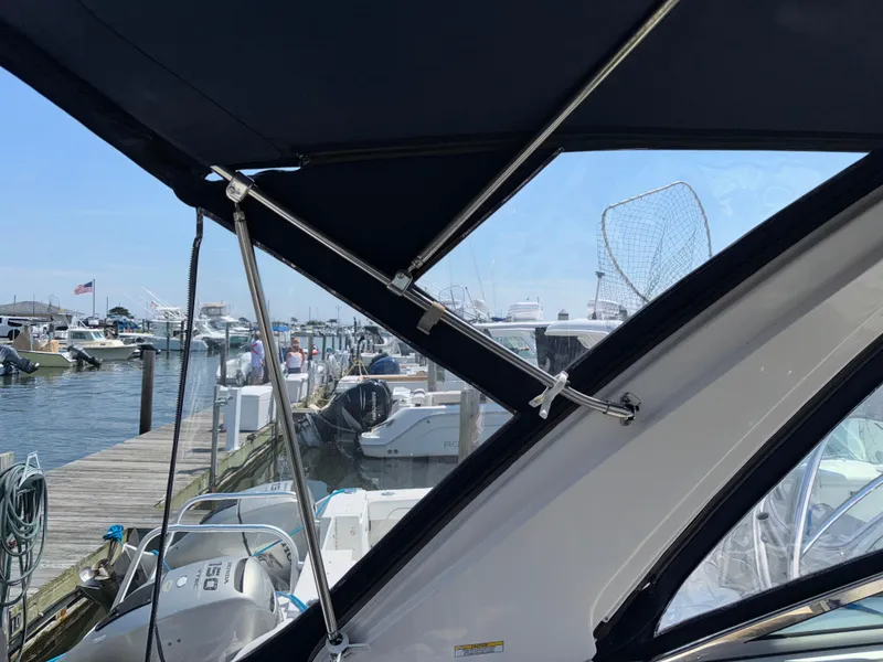 Slide: The Image of 2017 Regal 28 Express boat docked at marina, view from interior. - 13
