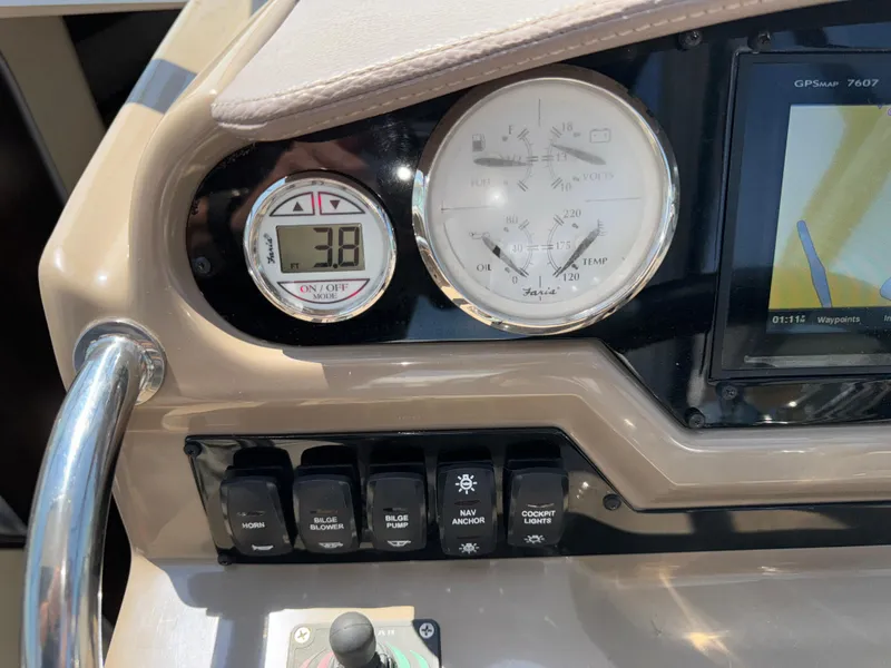 Slide: The Image of Dashboard of a 2017 Regal 28 Express boat with gauges and controls. - 30