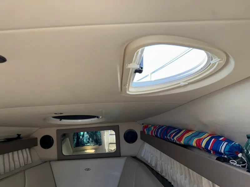 Slide: The Image of Interior cabin of 2017 Regal 28 Express boat with porthole and colorful decor. - 45