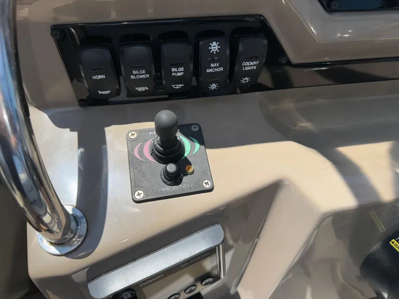Slide: The Image of Control panel of 2017 Regal 28 Express boat with joystick and switches. - 36