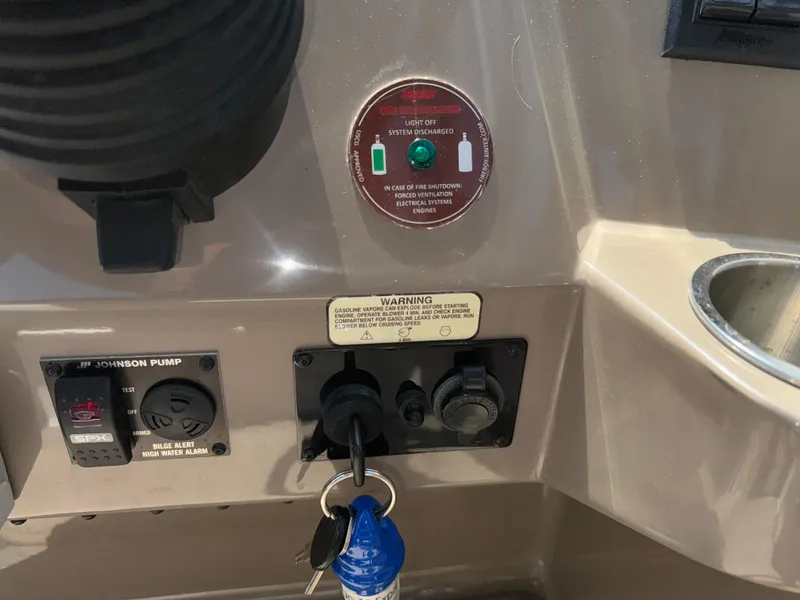 Slide: The Image of Control panel of a 2017 Regal 28 Express boat with ignition keys. - 33