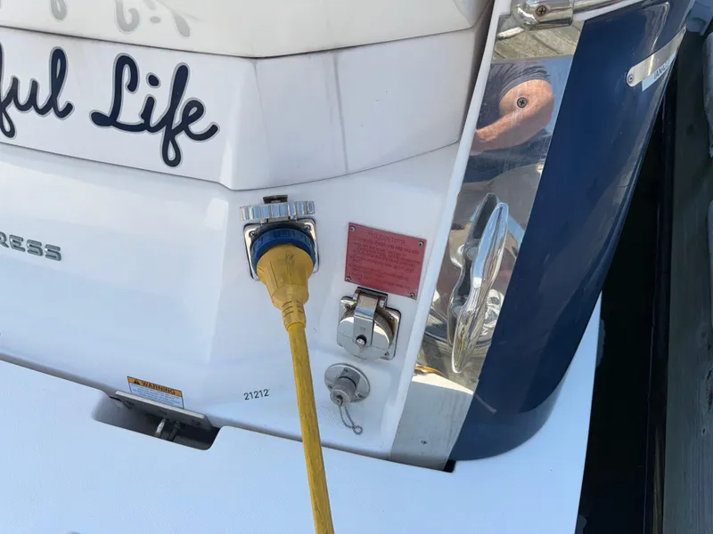 Slide: The Image of 2017 Regal 28 Express boat with power connection and "Joyful Life" text. - 16