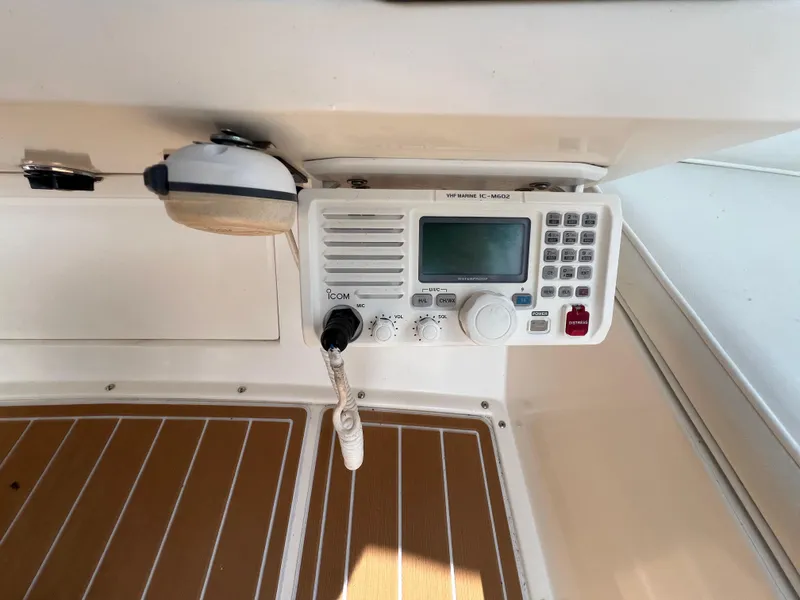 Slide: The Image of Radio equipment on a 1990 Bertram 28 Flybridge boat dashboard. - 19
