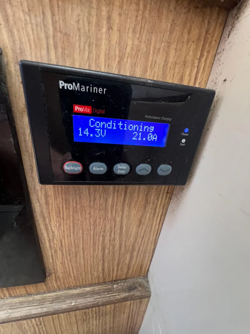 Slide: The Image of ProMariner battery charger display on 1990 Bertram 28 Flybridge boat. - 34