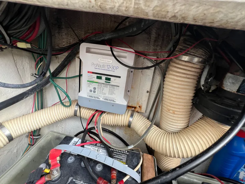 Slide: The Image of Engine compartment of a 1990 Bertram 28 Flybridge with battery and wiring. - 42
