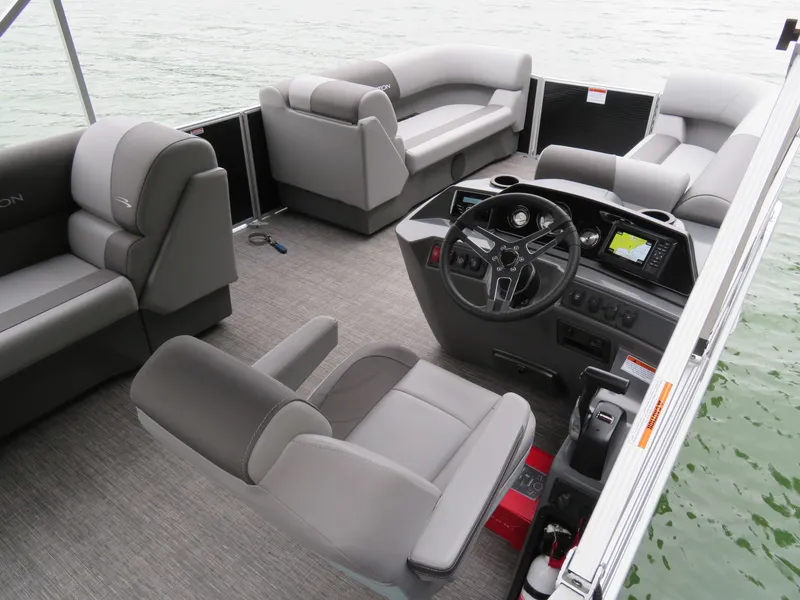 Slide: The Image of Interior of 2025 Bennington 20SVL-SPS pontoon boat with modern seating and navigation console. - 18