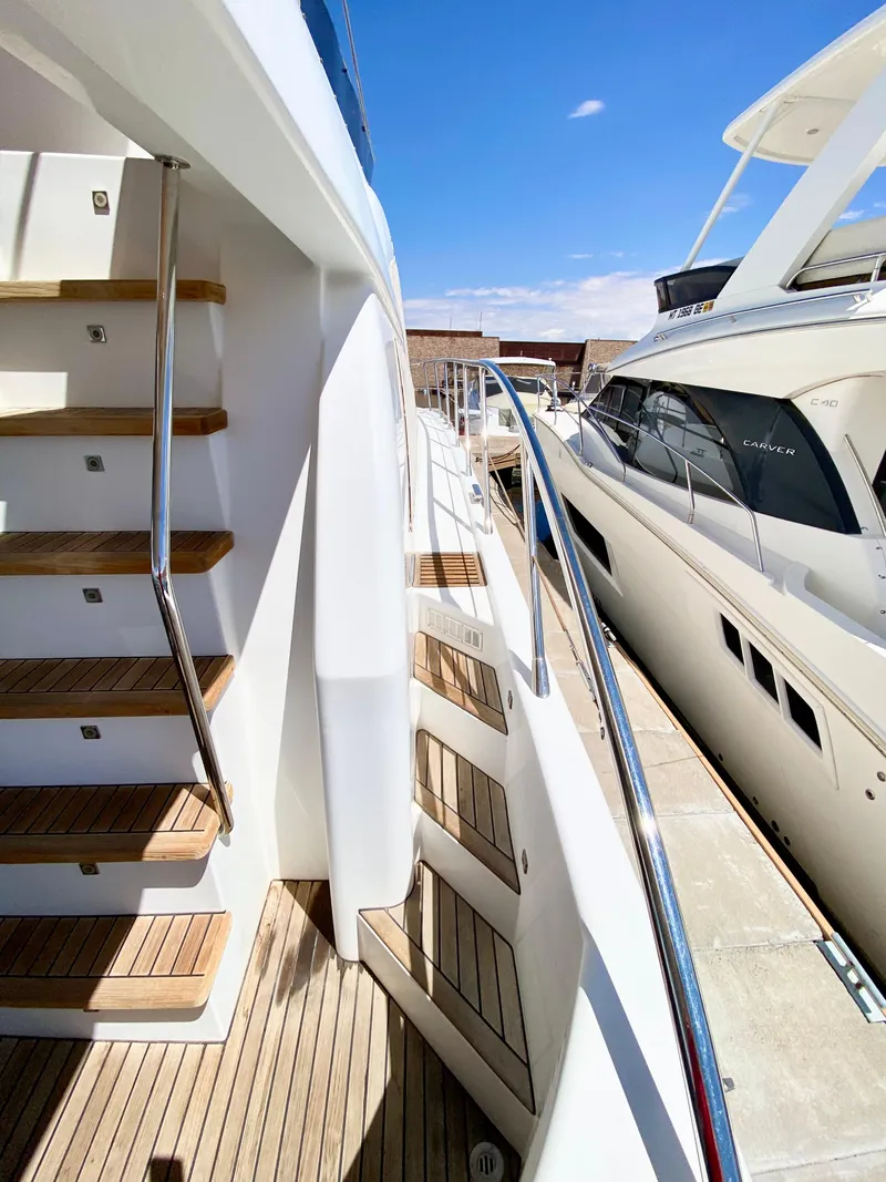 Slide: The Image of 2014 Dyna 52 yacht with sleek deck and modern design. - 11