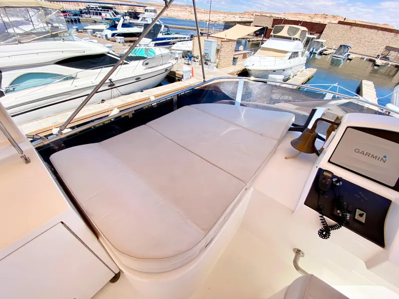 Slide: The Image of Dyna 52 yacht deck with seating, docked at marina, 2014 model. - 14