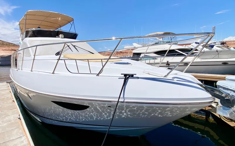 Slide: The Image of 2014 Dyna 52 yacht docked under clear blue sky. - 17