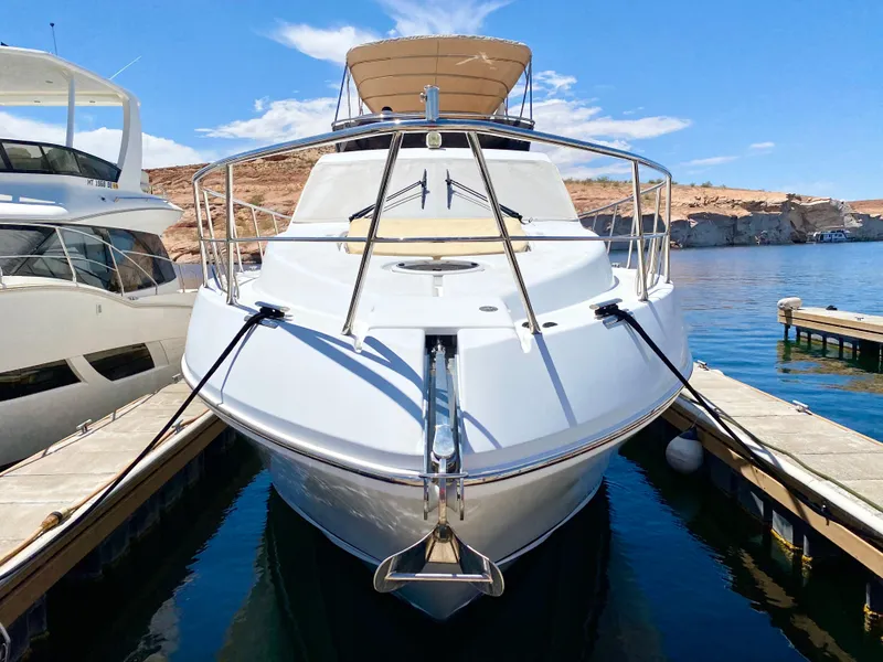 Slide: The Image of 2014 Dyna 52 yacht docked at marina under clear blue sky. - 19