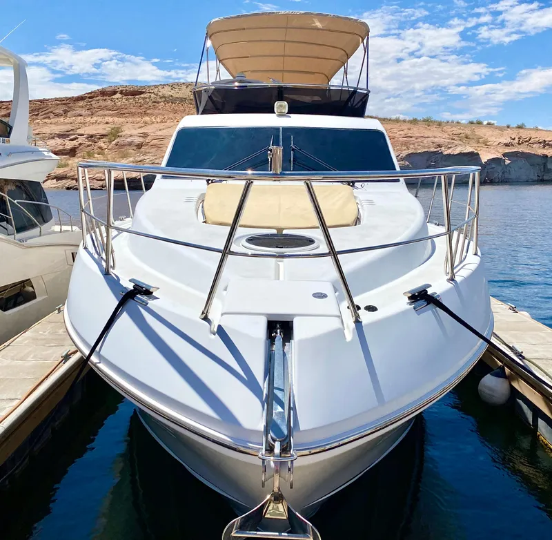Slide: The Image of 2014 Dyna 52 yacht docked on a sunny day with clear skies. - 2