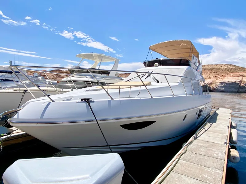 Slide: The Image of Luxurious 2014 Dyna 52 yacht docked under a clear blue sky. - 20