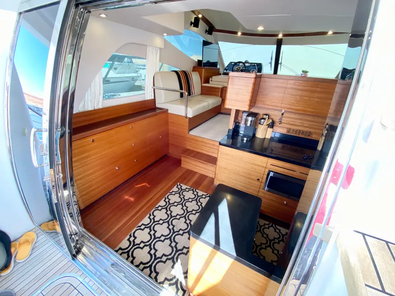 Slide: The Image of Luxurious interior of 2014 Dyna 52 yacht with modern wood finishes and elegant seating. - 23