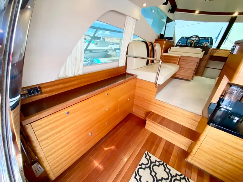 Slide: The Image of Luxurious 2014 Dyna 52 yacht interior with elegant wood finishes and modern design. - 25