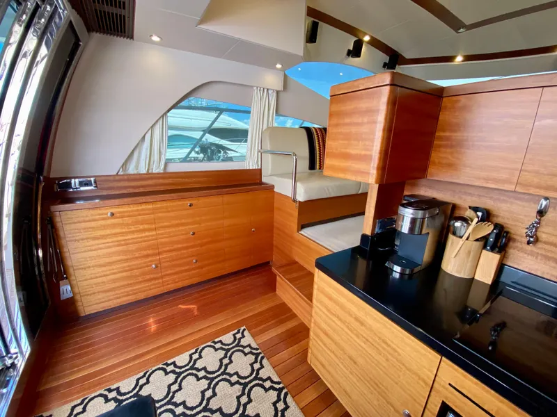 Slide: The Image of Luxurious interior of 2014 Dyna 52 yacht with wooden cabinetry and modern amenities. - 27