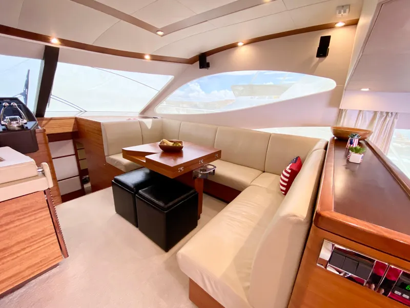 Slide: The Image of Luxurious interior of 2014 Dyna 52 yacht with elegant seating and wooden accents. - 30