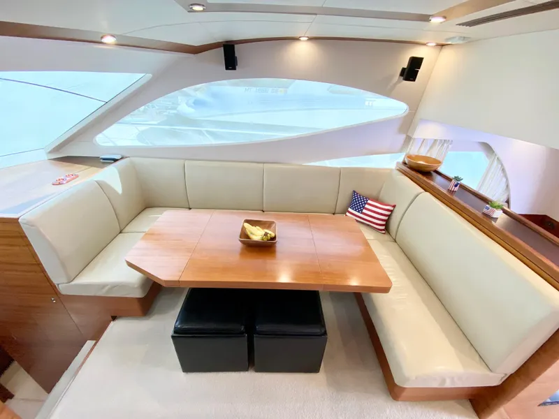 Slide: The Image of Luxurious interior of 2014 Dyna 52 yacht with elegant seating and wooden table. - 33