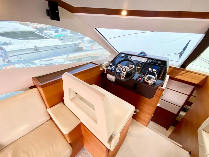 Slide: The Image of Luxurious interior of 2014 Dyna 52 yacht with modern helm and seating. - 35